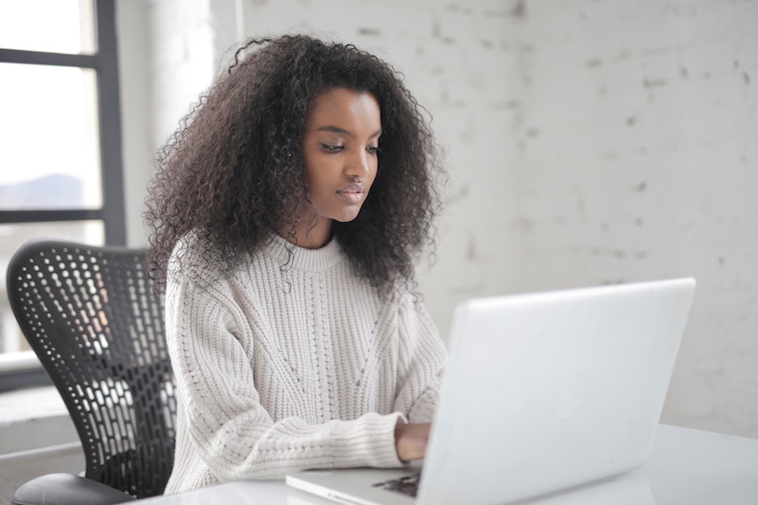 photo of woman using laptop 3891135